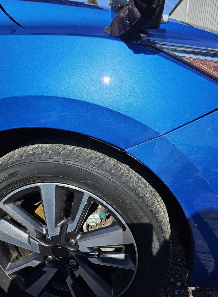 After: fender dent corrected with paintless dent repair