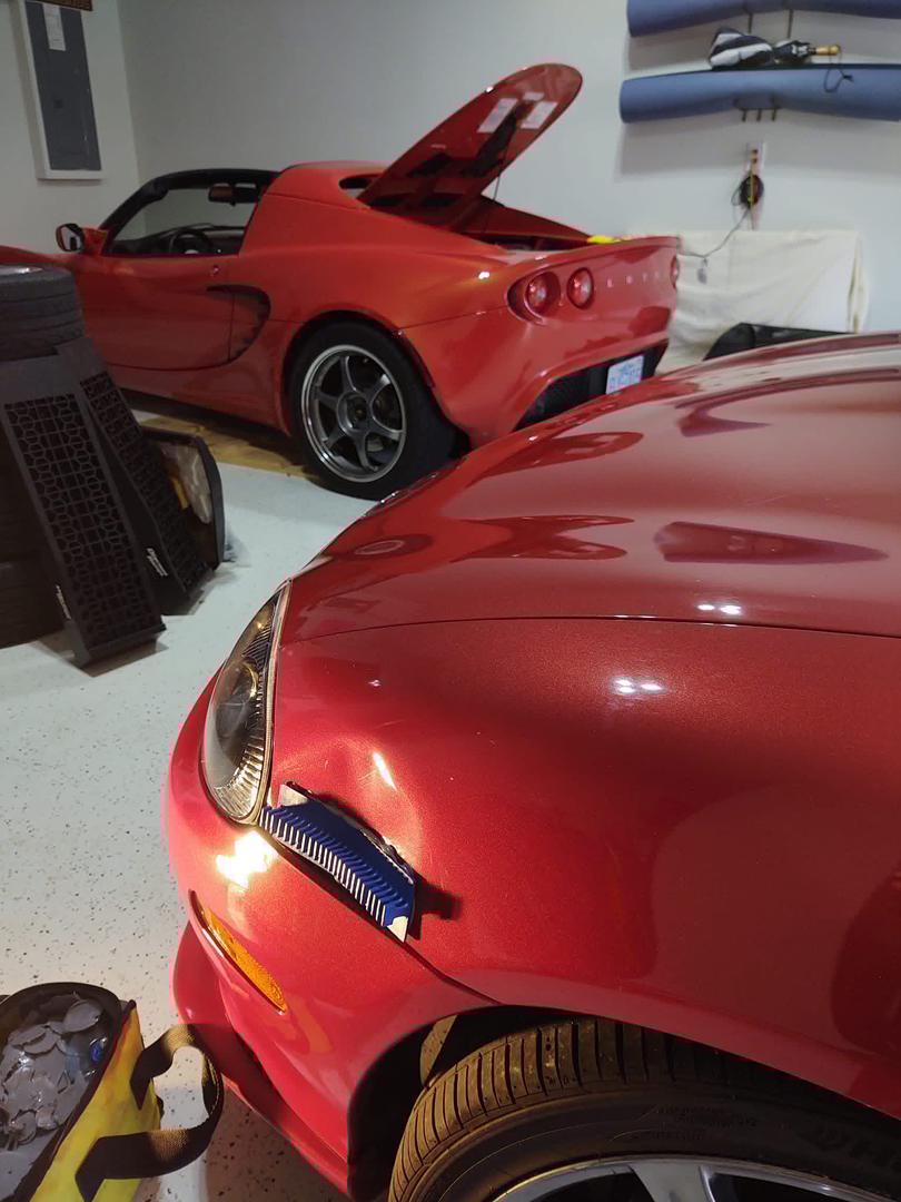Before: fender dent on red Miata in Central North Carolina