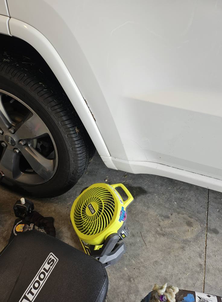 After: fender dent removed with paintless dent repair, factory finish preserved